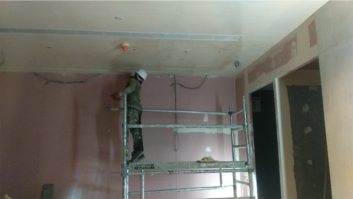 Premium liquor store interior with illuminated racks and zoned layout